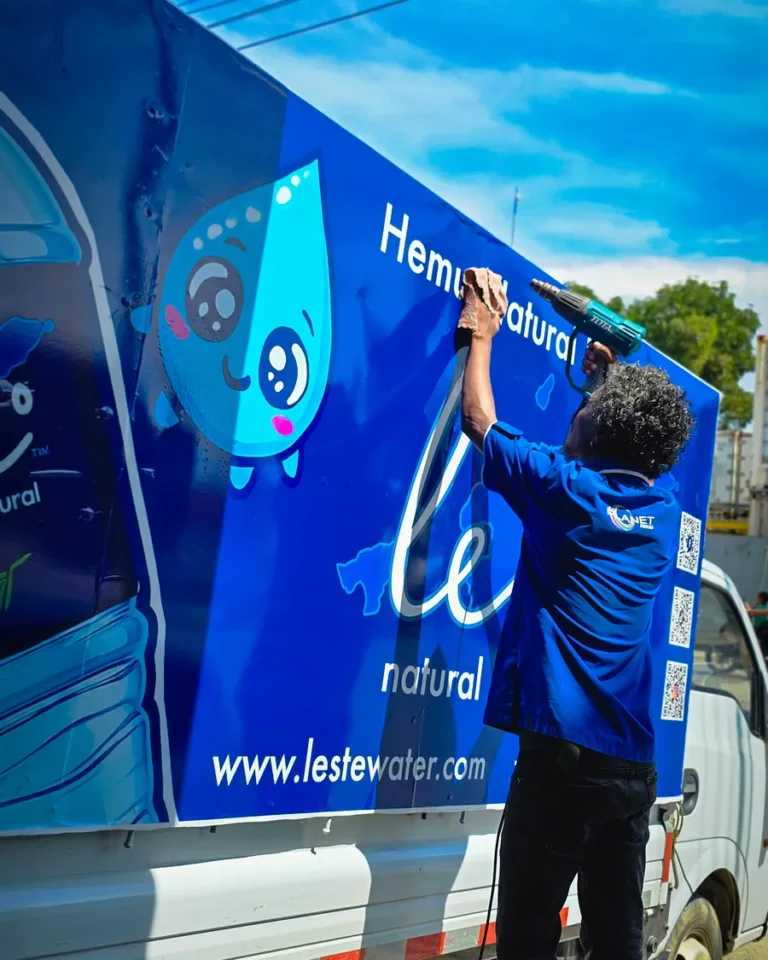 Delivery truck wrap being applied — Planet Printing, Dili