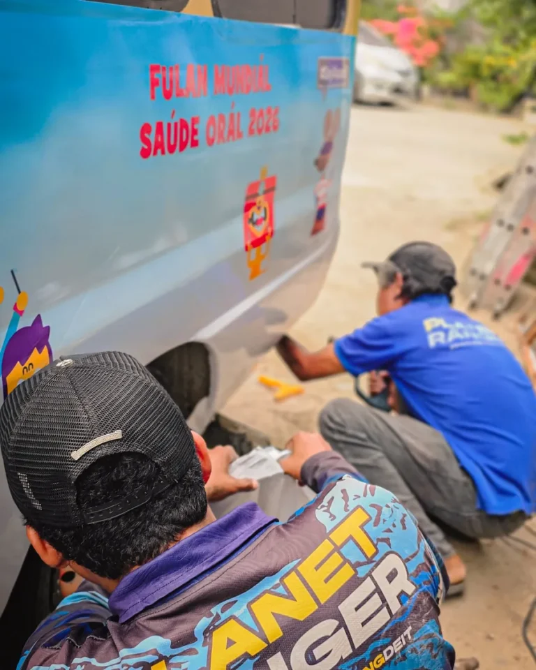 Van branding in progress — Planet Printing, Dili