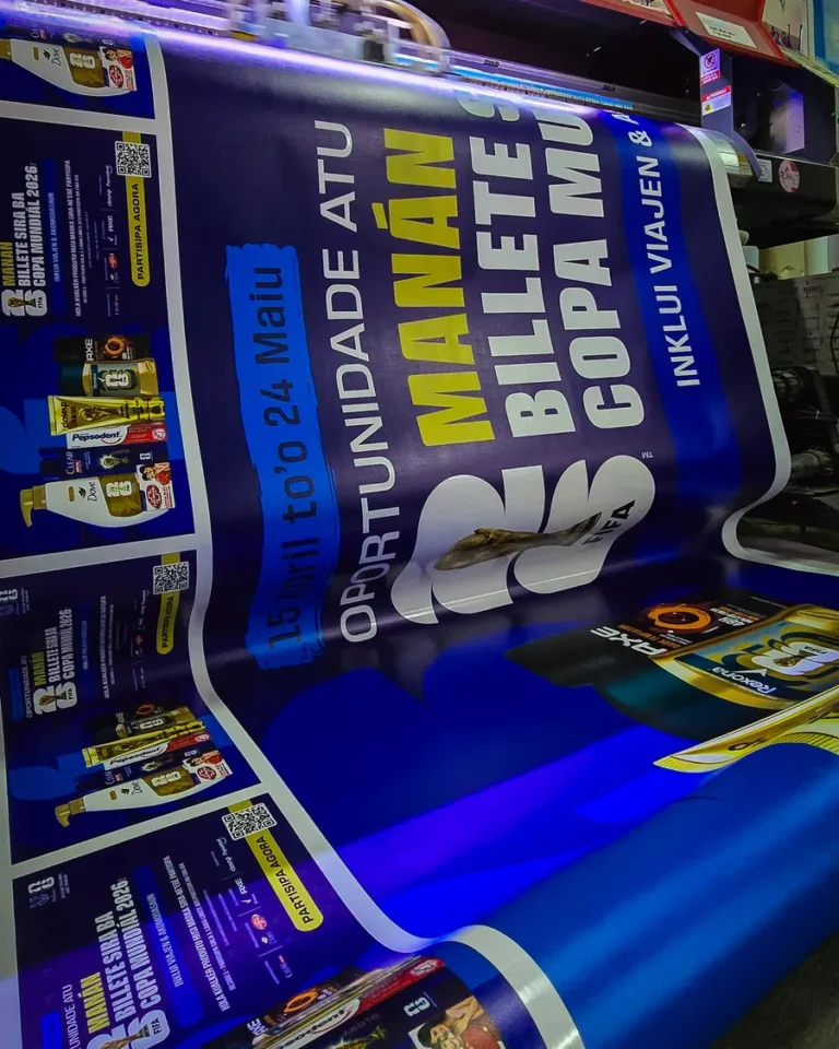 Large-format banner fresh off the printer — Planet Printing, Dili