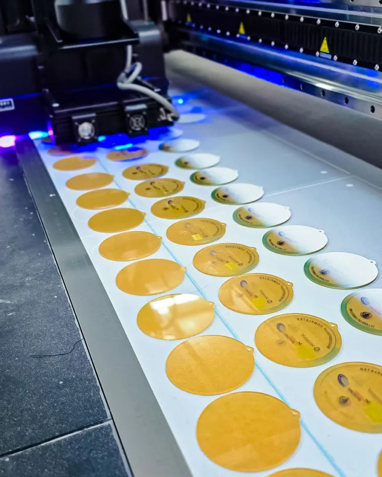 UV flatbed printing a batch of stickers — Planet Printing, Dili